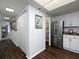 Hallway with hardwood floors and access to laundry and kitchen at 75 Fair Haven Se Way, Smyrna, GA 30080