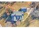 Aerial view of a well-maintained house and surrounding landscape, showcasing its location at 3975 Mcconnell Rd, Cumming, GA 30028
