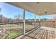 Spacious back porch with metal railings, offering serene outdoor views of the surrounding landscape at 3975 Mcconnell Rd, Cumming, GA 30028
