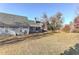 A view of the grassy backyard and the rear exterior of the home at 3975 Mcconnell Rd, Cumming, GA 30028
