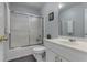 Bathroom featuring a sink with white cabinetry and shower-tub combination at 3975 Mcconnell Rd, Cumming, GA 30028