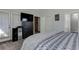 Well-appointed bedroom with television and easy access to bathroom and private patio at 3975 Mcconnell Rd, Cumming, GA 30028
