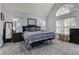 Spacious bedroom boasts vaulted ceiling, ample natural light, and neutral color palette at 3975 Mcconnell Rd, Cumming, GA 30028