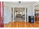 Elegant foyer with hardwood floors, white columns, and an open view into the living area at 3975 Mcconnell Rd, Cumming, GA 30028