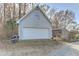 Detached garage with a separate shed, providing ample storage space at 3975 Mcconnell Rd, Cumming, GA 30028