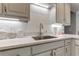 Beautiful kitchen featuring white cabinets, quartz countertops, and stainless steel sink at 3975 Mcconnell Rd, Cumming, GA 30028