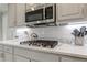 Modern kitchen features stainless steel appliances, gas cooktop, and white subway tile backsplash at 3975 Mcconnell Rd, Cumming, GA 30028