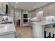 Modern kitchen with light gray cabinets, quartz countertops, and stainless steel appliances at 3975 Mcconnell Rd, Cumming, GA 30028