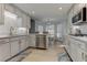 Bright eat-in kitchen with stainless steel appliances, light wood floors, and bay window at 3975 Mcconnell Rd, Cumming, GA 30028