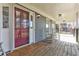 Inviting porch with wooden floors and rocking chairs, perfect for relaxing and enjoying the outdoors at 3975 Mcconnell Rd, Cumming, GA 30028