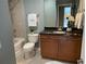 Well-lit bathroom features a granite vanity, shower-tub combination, and white towels for a clean, spa-like feel at 855 Peachtree Ne St # 2306, Atlanta, GA 30308