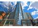 Exterior shot of a modern, high-rise condominium building with large glass windows and a sleek design at 855 Peachtree Ne St # 2306, Atlanta, GA 30308
