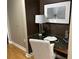 Compact and stylish desk area with a reading lamp and decorative accents at 855 Peachtree Ne St # 2306, Atlanta, GA 30308
