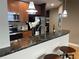Well-equipped kitchen featuring stainless steel appliances, granite countertops, and a breakfast bar at 855 Peachtree Ne St # 2306, Atlanta, GA 30308