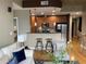 Open floor plan living room with adjacent kitchen featuring modern furnishings and decor at 855 Peachtree Ne St # 2306, Atlanta, GA 30308