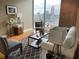 Cozy living room with large windows offering expansive city views and modern decor at 855 Peachtree Ne St # 2306, Atlanta, GA 30308