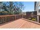 View of the back deck overlooking trees and backyard at 678 Emeril Dr, Avondale Estates, GA 30002