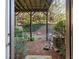 Small, wooded backyard featuring patio area and greenery at 678 Emeril Dr, Avondale Estates, GA 30002