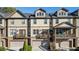 Attractive townhome exteriors with private balconies, garages, and inviting curb appeal at 678 Emeril Dr, Avondale Estates, GA 30002
