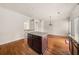 Kitchen features an island, hardwood floors, and modern lighting at 678 Emeril Dr, Avondale Estates, GA 30002