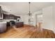 Eat-in kitchen with stainless appliances, hardwood floors, and center island at 678 Emeril Dr, Avondale Estates, GA 30002