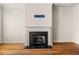 Living room featuring a fireplace, hardwood floors, and neutral paint at 678 Emeril Dr, Avondale Estates, GA 30002