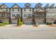 Charming townhomes featuring individual garages and covered porches in a well-maintained community at 678 Emeril Dr, Avondale Estates, GA 30002