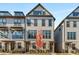 Charming townhome with a brick foundation, gray siding, and neatly landscaped front yard at 3980 Allegretto Cir, Atlanta, GA 30339