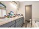 Bathroom with a white sink, gray cabinets, and neutral countertops at 275 Helen Ln, Stockbridge, GA 30281