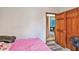 Bedroom with hardwood style flooring, an open doorway, and closet at 275 Helen Ln, Stockbridge, GA 30281