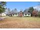 Inviting single-Gathering home featuring a red front door and beautiful stonework accents at 275 Helen Ln, Stockbridge, GA 30281