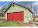 External view of detached garage with a red garage door at 275 Helen Ln, Stockbridge, GA 30281