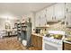 Functional kitchen with abundant cabinet space and tiled flooring at 275 Helen Ln, Stockbridge, GA 30281