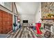 Cozy living room with a stone fireplace and stylish wood-look floors at 275 Helen Ln, Stockbridge, GA 30281