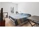 Bedroom with carpet features a window and a bed with a patterned blue coverlet at 4192 Integrity Way, Powder Springs, GA 30127