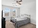 This cozy bedroom offers natural light with a ceiling fan and simple design at 4192 Integrity Way, Powder Springs, GA 30127