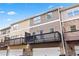 Townhome exterior featuring private decks above garages, with mixed brick and siding facades at 4192 Integrity Way, Powder Springs, GA 30127