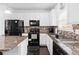 Bright kitchen with granite countertops, stainless steel appliances, and stylish backsplash at 4192 Integrity Way, Powder Springs, GA 30127