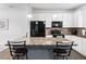 Open concept kitchen with island, granite countertops and black stainless steel appliances at 4192 Integrity Way, Powder Springs, GA 30127