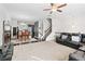 Spacious open concept living room with dark hardwood floors and plush carpet at 4192 Integrity Way, Powder Springs, GA 30127