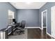Home office features modern desk, chair, hardwood floors and natural light at 4192 Integrity Way, Powder Springs, GA 30127