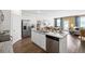 Open concept kitchen featuring stainless steel appliances, granite countertops and an island at 142 Oakchase Park Ln, Hampton, GA 30228