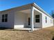 Back patio space with a covered area for enjoying outdoor living at 142 Oakchase Park Ln, Hampton, GA 30228