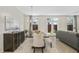 Elegant dining room featuring a modern chandelier, a large dining table, and stylish decor at 1416 Lucan Ln # Wc220, Lawrenceville, GA 30043