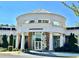 View of Jacqueline Casey Hudgens Center featuring architectural columns and a circular modern design at 1416 Lucan Ln # Wc220, Lawrenceville, GA 30043