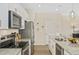 Modern kitchen with granite countertops, stainless steel appliances and ample cabinet space at 1416 Lucan Ln # Wc220, Lawrenceville, GA 30043
