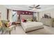 Spacious main bedroom suite with tray ceiling, ceiling fan, and large windows at 1416 Lucan Ln # Wc220, Lawrenceville, GA 30043