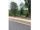 Scenic view of a park with benches and shade trees creating a tranquil outdoor space at 1416 Lucan Ln # Wc220, Lawrenceville, GA 30043