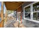 View of a wood balcony with gray siding and modern light fixtures at 60 Newcastle Sw St, Atlanta, GA 30314