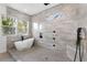 The modern bathroom features a large tiled shower, two windows, and black fixtures at 60 Newcastle Sw St, Atlanta, GA 30314